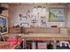Organized workshop with pegboard walls, a wooden workbench, and ample lighting, perfect for DIY projects and hobbies at 55 Hazelbrook Way, Acworth, GA 30101