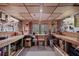 Functional workshop with pegboard walls for tool storage, a spacious workbench, and natural light from the window at 55 Hazelbrook Way, Acworth, GA 30101