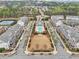 Aerial view of townhomes showcasing the community layout, landscaping, and central amenities at 115 Harlow Cir, Roswell, GA 30076