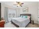 Comfortable bedroom featuring a large window, neutral color scheme, and a comfortable queen bed at 115 Harlow Cir, Roswell, GA 30076
