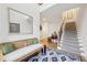 Inviting foyer with a staircase, a bench, and a decorative rug at 115 Harlow Cir, Roswell, GA 30076