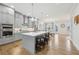 Modern kitchen with a large center island, stainless steel appliances, and light gray cabinets at 115 Harlow Cir, Roswell, GA 30076