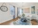 Comfortable living room with a stylish area rug, chandelier lighting, and plenty of natural light at 115 Harlow Cir, Roswell, GA 30076