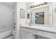 Bathroom features a shower-tub combination and a vanity area with storage cabinets at 1606 Vicksburg Pl, Atlanta, GA 30350