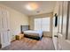 Bright bedroom with a modern bed frame, a window providing natural light, and neutral-toned walls at 290 Brookview Dr, Riverdale, GA 30274