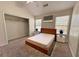 Relaxing primary bedroom with a vaulted ceiling, a ceiling fan, closet and natural light at 290 Brookview Dr, Riverdale, GA 30274