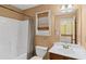 Bathroom featuring a shower/tub combo, window, and large mirror at 453 Clematis Ct, Temple, GA 30179