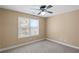 Bedroom with neutral walls and carpet with a window at 453 Clematis Ct, Temple, GA 30179