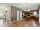 Open kitchen with stainless steel appliances, granite countertops, and a central island, perfect for cooking and entertaining at 453 Clematis Ct, Temple, GA 30179