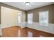 Inviting living room featuring hardwood floors, white trim, and lots of natural light at 453 Clematis Ct, Temple, GA 30179