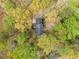 Aerial view of a home with mature tree coverage at 6695 Woodstock Rd, Acworth, GA 30102
