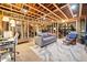 Unfinished basement featuring exposed beams and ductwork with bonus living area at 6695 Woodstock Rd, Acworth, GA 30102