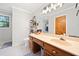 Bathroom features wood vanity, built-in makeup table, and neutral walls at 6695 Woodstock Rd, Acworth, GA 30102