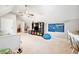 Bonus room with vaulted ceiling, playroom space, and natural light at 6695 Woodstock Rd, Acworth, GA 30102