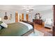 Main bedroom features hardwood floors, neutral walls, and walk-in closet at 6695 Woodstock Rd, Acworth, GA 30102