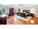 Spacious main bedroom with wood floors and view to outdoors at 6695 Woodstock Rd, Acworth, GA 30102