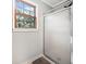 Bathroom with glass-enclosed shower and window for natural light at 6695 Woodstock Rd, Acworth, GA 30102