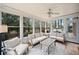Bright sunroom with abundant windows and comfortable seating, perfect for relaxation at 6695 Woodstock Rd, Acworth, GA 30102