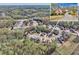 Aerial view of residential neighborhood with mature trees and well-maintained homes and inset of home exterior at 2323 Council Ln, Buford, GA 30519
