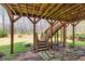 View of wooden deck with stairs descending onto a stone path, showcasing a private backyard retreat at 2323 Council Ln, Buford, GA 30519