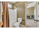 Well-maintained bathroom with a tub-shower combination and an adjacent room view at 2323 Council Ln, Buford, GA 30519