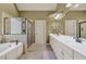 Bright bathroom with double vanity, soaking tub, and glass enclosed shower at 2323 Council Ln, Buford, GA 30519