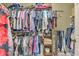 Walk-in closet filled with clothes, shelves, and rods for maximum storage and organization at 2323 Council Ln, Buford, GA 30519