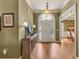 Inviting home entryway featuring hardwood floors, console table, and arched doorway at 2323 Council Ln, Buford, GA 30519