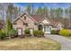 Charming single-Gathering home with brick facade and manicured landscaping at 2323 Council Ln, Buford, GA 30519