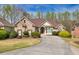 Charming single-Gathering home with brick facade, manicured landscaping and curved driveway at 2323 Council Ln, Buford, GA 30519