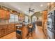 Well-equipped kitchen with island seating opens to a living room, creating a perfect space for entertaining at 2323 Council Ln, Buford, GA 30519