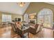Spacious living room with vaulted ceiling, fireplace, leather sofas, and large windows at 2323 Council Ln, Buford, GA 30519