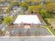 Aerial view of mixed-use commercial building with a modern facade, ample parking, and professional landscaping at 510 James P. Brawley Dr. Nw Dr, Atlanta, GA 30318