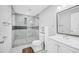 This bathroom features a tiled shower, light cabinets, and neutral paint at 510 James P. Brawley Dr. Nw Dr, Atlanta, GA 30318