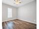 This bedroom features wood flooring, neutral paint, and a ceiling fan at 510 James P. Brawley Dr. Nw Dr, Atlanta, GA 30318