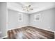 This bedroom features wood flooring, neutral paint, and two windows at 510 James P. Brawley Dr. Nw Dr, Atlanta, GA 30318