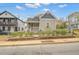 Charming craftsman-style home with gray siding, fenced yard, and inviting front porch at 510 James P. Brawley Dr. Nw Dr, Atlanta, GA 30318