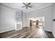 Open-concept living room flows into the kitchen, featuring hardwood floors and fireplace at 510 James P. Brawley Dr. Nw Dr, Atlanta, GA 30318