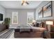The main bedroom features a queen bed, gray walls, and decor at 510 James P. Brawley Dr. Nw Dr, Atlanta, GA 30318
