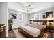 This main bedroom boasts a king bed, wood accents, and neutral decor at 510 James P. Brawley Dr. Nw Dr, Atlanta, GA 30318