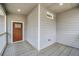 Cozy front porch with wood flooring, offers a welcoming entryway to the home at 510 James P. Brawley Dr. Nw Dr, Atlanta, GA 30318