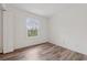 Cozy bedroom featuring hardwood floors and a bright window view at 554 Mcgill Ne Pl, Atlanta, GA 30312