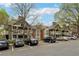 Inviting two-story condo buildings with ample parking spaces and a quaint, wooded landscape at 554 Mcgill Ne Pl, Atlanta, GA 30312
