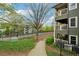 Exterior view of the building featuring balconies and lush landscaping at 554 Mcgill Ne Pl, Atlanta, GA 30312