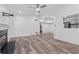 Open floor plan reveals spacious living room with hardwood floors, fireplace, and a view of the kitchen at 554 Mcgill Ne Pl, Atlanta, GA 30312