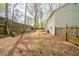 View of the spacious backyard and fence line at 5175 Walker Rd, Stone Mountain, GA 30088