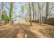 View of backyard area with some trees at 5175 Walker Rd, Stone Mountain, GA 30088
