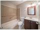 Bathroom featuring a tub and shower combination with tile surround at 5175 Walker Rd, Stone Mountain, GA 30088