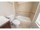 Neutral bathroom features a tiled shower-tub combo and tile floors at 5175 Walker Rd, Stone Mountain, GA 30088