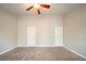 Spacious bedroom featuring carpet flooring and a ceiling fan at 5175 Walker Rd, Stone Mountain, GA 30088